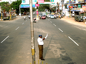 Traffic Police Guiding the vehicles at Avanashi Road Signal